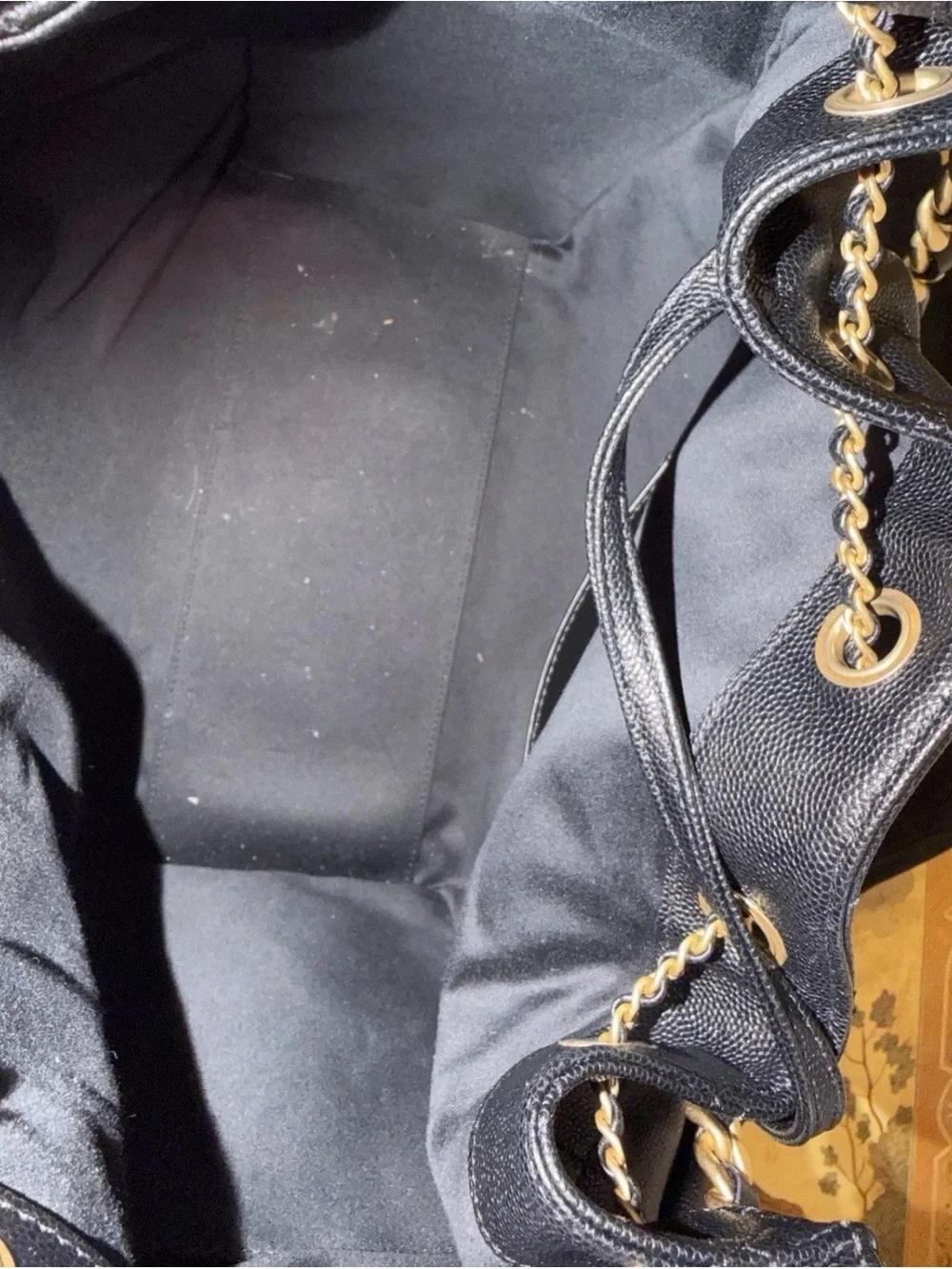 Chanel 25 bag in black grain leather and golden hardware. Medium size.